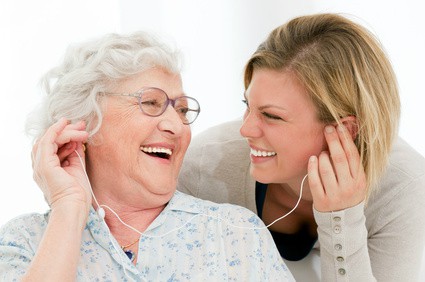 provider of dementia care in Jasper listening to music with senior patient