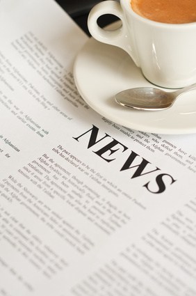 Coffee Sitting on top of news