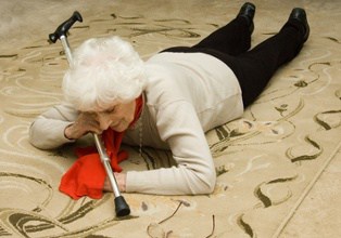 Old Woman On the Floor With Cane