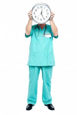 Doctor Holding a Clock