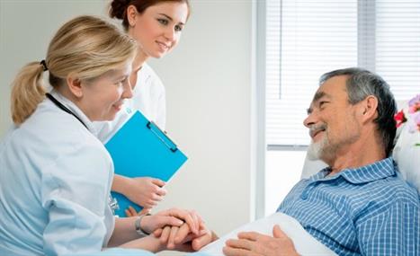 Doctor and Nurse Talking to an Elderly Patient